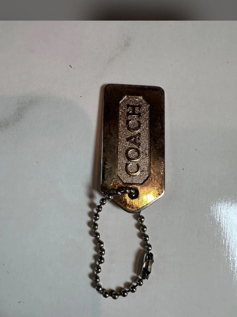 Coach Gold-Tone Logo Dog Tag Keychain